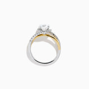 The Lab Grown Diamond Swirl Halo Ring in 14K Two-Tone Gold features a large round lab grown diamond center, surrounded by smaller diamonds in a spiral halo and set on dual gold and silver bands against a crisp white background.