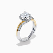 The Lab Grown Diamond Swirl Halo Ring in 14K Two-Tone Gold features a large round lab grown diamond center, surrounded by smaller diamonds in a spiral halo and set on dual gold and silver bands against a crisp white background.