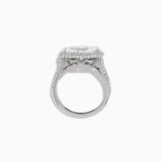 The Lab Grown Diamond East-West Oval Halo Ring in 14K White Gold showcases a brilliant lab-grown diamond center, accented by sparkling stones along the band, beautifully set against a plain white background.