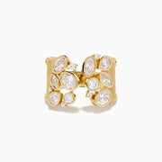 The Lab Grown Multi Shape Diamond Open Shank Textured Ring in 14K Yellow Gold features an open front with oval and marquise lab-grown diamonds arranged in a scattered, leaf-inspired pattern.