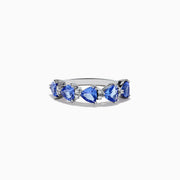 The Nahla Siri 14K White Gold Tanzanite and Diamond Ring features five heart-shaped blue tanzanite gemstones set side by side on a slender band, displayed on a white background.