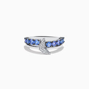 The 925 Sterling Silver Tanzanite and Diamond Fin Ring showcases tanzanite stones across the band, accented with a crescent design adorned with sparkling diamonds.