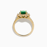The Brasilica 14K Yellow Gold Emerald and Diamond 3 Stone Ring features an oval green emerald and sparkling diamonds on a diamond-studded band—an elegant choice for any occasion.