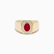 The Men's 14K Yellow Gold Bezel Halo Ruby and Diamond Signet Ring showcases an oval ruby center, encircled by a halo of white diamonds, all set in yellow gold against a white background.
