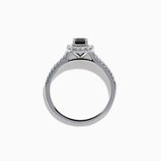 The 14K White Gold White and Black Diamond Halo Ring features a rectangular black center stone surrounded by white diamonds, with more diamonds along the band, all presented on a white background.