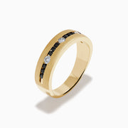The Mens 14K Yellow Gold White and Black Diamond Band Ring features alternating black and white round diamonds set in the center, showcased against a plain white background.