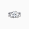 The Bouquet 14K White Gold Diamond Ring features a cluster of round diamonds in the center with curved bands of smaller diamonds, all elegantly set in 14K white gold.