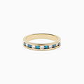 The Bella Bleu 14K Yellow Gold White and Blue Diamond Ring features alternating round blue and white diamonds in a single row, displayed on a plain white background.