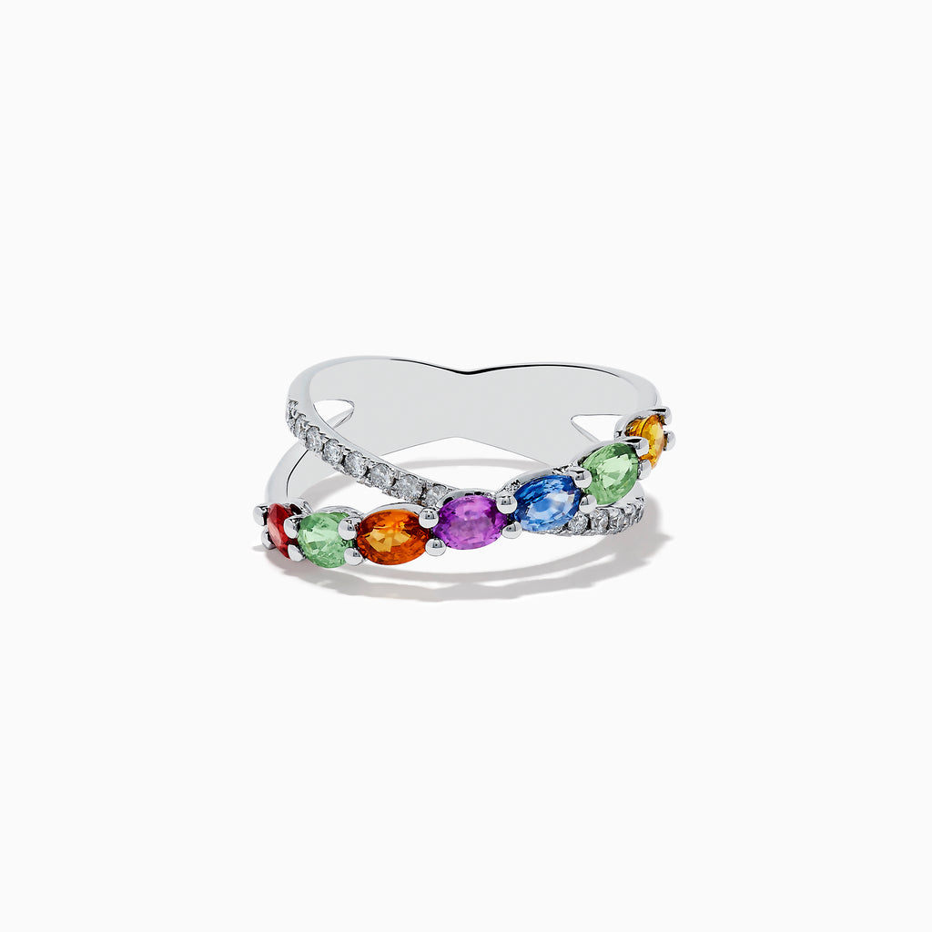 The Watercolors 14K White Gold Multi Sapphire and Diamond Crossover Ring features a crisscross design with vivid multicolored sapphires and a band set with sparkling diamonds, all showcased against a plain white background.