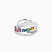 The Watercolors 14K White Gold Multi Sapphire and Diamond Crossover Ring features a crisscross design with vivid multicolored sapphires and a band set with sparkling diamonds, all showcased against a plain white background.