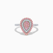 The 14K Two Tone Pink and White Diamond Ring features a teardrop shape with concentric rows of pink and white diamonds on a silver band, highlighted by a central cluster of pink stones.