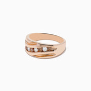 The Mens 14K Rose Gold Espresso and White Diamond Ring showcases a diagonal row of seven round white diamonds at the center, highlighted by engraved wave patterns on each side of its elegant 14K rose gold band.