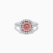 The 18K Two Tone Gold White and Pink Diamond Ring showcases a square pink center stone, encircled by a halo of pink diamonds and a second halo of white diamonds, with more diamonds set along its sophisticated band.