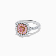 The 18K Two Tone Gold White and Pink Diamond Ring showcases a square pink center stone, encircled by a halo of pink diamonds and a second halo of white diamonds, with more diamonds set along its sophisticated band.