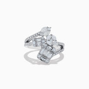 The Classique 14K White Gold Diamond Crossover Ring features an elegant, twisting band set with round and baguette-cut diamonds, shown against a white background.