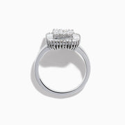The 14K White Gold Diamond Statement Ring showcases a square-shaped setting with a cluster of round diamonds at the center, bordered by baguette-cut diamonds.
