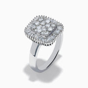 The 14K White Gold Diamond Statement Ring showcases a square-shaped setting with a cluster of round diamonds at the center, bordered by baguette-cut diamonds.