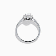 The Classique 14K White Gold Diamond Cluster Ring features an oval center diamond haloed by smaller diamonds, plus additional diamonds along its elegant band.
