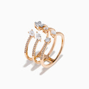 The Pave Rose 14K Rose Gold Diamond Ring features four open bands adorned with pavé diamonds and assorted clear gemstones—including teardrop and rectangular cuts—for an elegant, multi-layered look.
