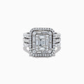 The 14K White Gold Diamond Ring features a rectangular emerald-cut diamond center, two rows of smaller round diamonds, and three diamond-accented bands on each side for a dazzling effect.