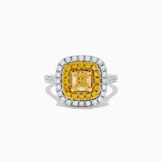 The Canare 14k Two Tone Gold Cushion Cut Double Halo Yellow Diamond Ring (1.86 TCW) features a vibrant yellow diamond centerpiece, framed by a double halo of yellow and white diamonds on a sleek two-tone band.