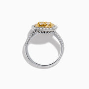 The Canare 14K Two Tone Gold White and Yellow Diamond Ring features a square cluster of four yellow diamonds, surrounded by a halo and band of sparkling white diamonds.