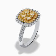 The Canare 14K Two Tone Gold White and Yellow Diamond Ring features a square cluster of four yellow diamonds, surrounded by a halo and band of sparkling white diamonds.
