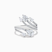 The Pave Classica 14k White Gold Open Shank Diamond Ring 1.0 TCW features four curved bands adorned with small and pear-shaped diamonds, elegantly set in white gold.
