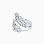 The Pave Classica 14k White Gold Open Shank Diamond Ring 1.0 TCW features four curved bands adorned with small and pear-shaped diamonds, elegantly set in white gold.