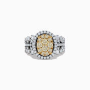The Canare 14K Two Tone White and Yellow Diamond Ring showcases an oval cluster of yellow diamonds, accented by a white diamond halo and band in a striking multi-row design.