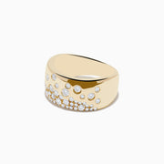 The DOro 14K Yellow Gold Scattered Diamonds Ring features a wide band adorned with round, sparkling white diamonds of varying sizes across the front, creating an elegant, textured pattern.