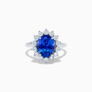 The Nahla Siri 14K White Gold Tanzanite and Diamond Ring showcases a large oval tanzanite center stone encircled by a halo of sparkling round white diamonds, all set in radiant 14K white gold.