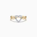 The Novelty 14K Two Tone Gold Diamond Heart Ring showcases a diamond-outlined heart at the center, joined on both sides by a chain-link inspired gold band.