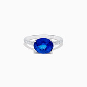The Nahla Siri 14K White Gold Tanzanite and Diamond Ring features a large oval tanzanite center stone with smaller diamonds along the band, shown against a plain white background.