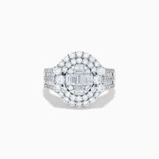 The 14K White Gold Diamond Cluster Ring showcases rectangular and round-cut diamonds in an oval setting with two halo layers on a diamond-accented split shank band.