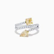 The Canare 18K Two Tone White and Yellow Diamond Bypass Ring features a spiral design with a row of small white diamonds, highlighted by yellow cushion-cut and pear-shaped diamonds set in yellow gold prongs.