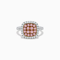 The 14K Two Tone Gold White and Pink Diamond Ring features a square cluster of pink stones at its center, bordered by white diamonds on the face and set on a polished band, showcasing the elegance of diamond accents.