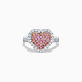 The Novelty 14K Two Tone Gold Pink and White Diamond Heart Ring features a heart-shaped centerpiece set with pink and white diamonds, accented by a sparkling border of clear, white stones.