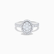 The Bouquet 14K White Gold Diamond Cluster Ring showcases an oval diamond cluster with a double halo of sparkling diamonds and extra diamonds set along the band.