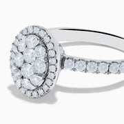 The Bouquet 14K White Gold Diamond Cluster Ring showcases an oval diamond cluster with a double halo of sparkling diamonds and extra diamonds set along the band.