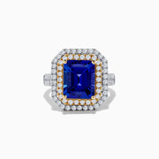 The Nahla Siri 14K Two Tone Gold Tanzanite and Diamond Ring features a rectangular tanzanite with a double halo of white and yellow diamonds, set in a two-tone gold band, shown against a white background.