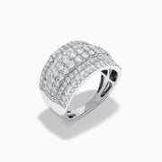 The 14K White Gold Diamond Wide Band Statement Ring showcases multiple rows of closely set round white diamonds, creating a dazzling and luxurious look against its wide, polished band. The background is plain white.
