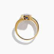 The Nahla 14K Yellow Gold Tanzanite and Diamond Bypass Ring features two square-cut tanzanites on each end of an open band, accented with small rectangular diamonds along the yellow gold band.
