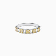 The Canare 18K Two Tone Gold White and Yellow Gold Diamond Band Ring features alternating rectangular yellow and clear diamonds set in a row along the band, shown on a white background.