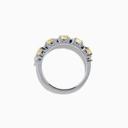 The Canare 18K Two Tone Gold White and Yellow Gold Diamond Band Ring features alternating rectangular yellow and clear diamonds set in a row along the band, shown on a white background.