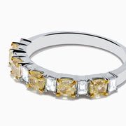 The Canare 18K Two Tone Gold White and Yellow Gold Diamond Band Ring features alternating rectangular yellow and clear diamonds set in a row along the band, shown on a white background.
