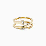 The 14K Yellow Gold Diamond Wrap Ring features two intertwined bands—one with a pear-shaped clear gemstone, the other accented by sparkling round diamonds along the top half—for an elegant, dazzling look.