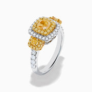 The Canare 18K Two Tone Gold White and Yellow Diamond Ring features a large rectangular yellow diamond center, encircled by rows of yellow and white diamonds, with side yellow diamonds bordered by sparkling white stones.