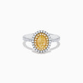 A close-up of the Canare 18K Two Tone Gold White & Yellow Diamond Ring, highlighting its oval yellow center stone encircled by two halos of white diamonds and additional diamonds set along the elegant silver band.
