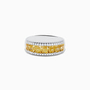 The Canare 18K Two Tone Gold White and Yellow Diamond Band Ring features a central row of yellow diamonds bordered by two rows of white diamonds, beautifully displayed on a white background.
